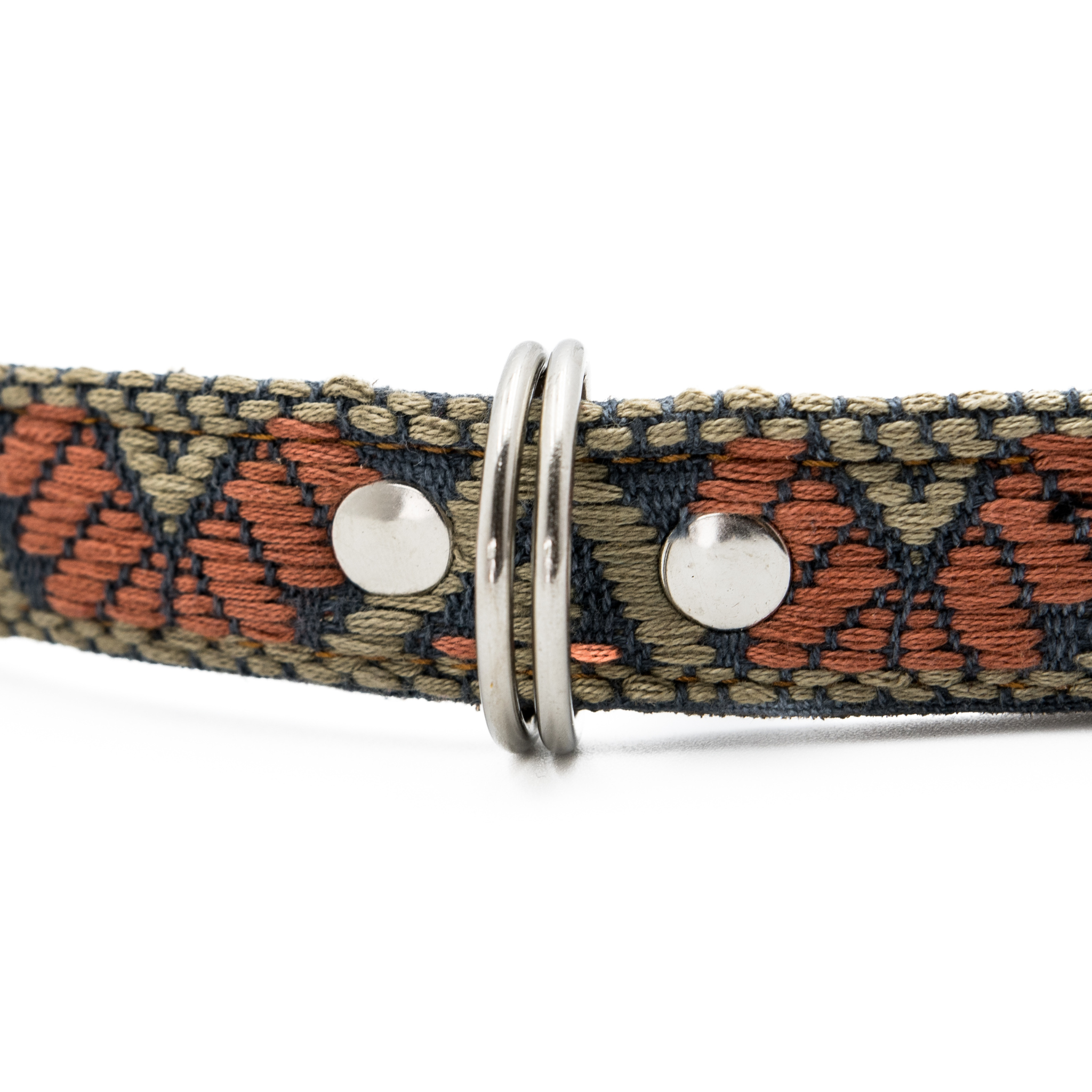 Detailed view of the D-ring and intricate embroidery on a Bronze Olive leather dog collar.