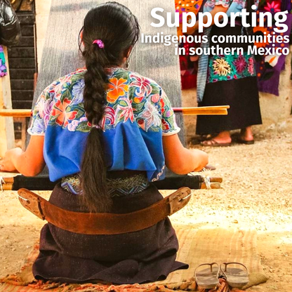Indigenous woman seen from behind, weaving embroidery on a Brown Rust dog collar, depicting craftsmanship.