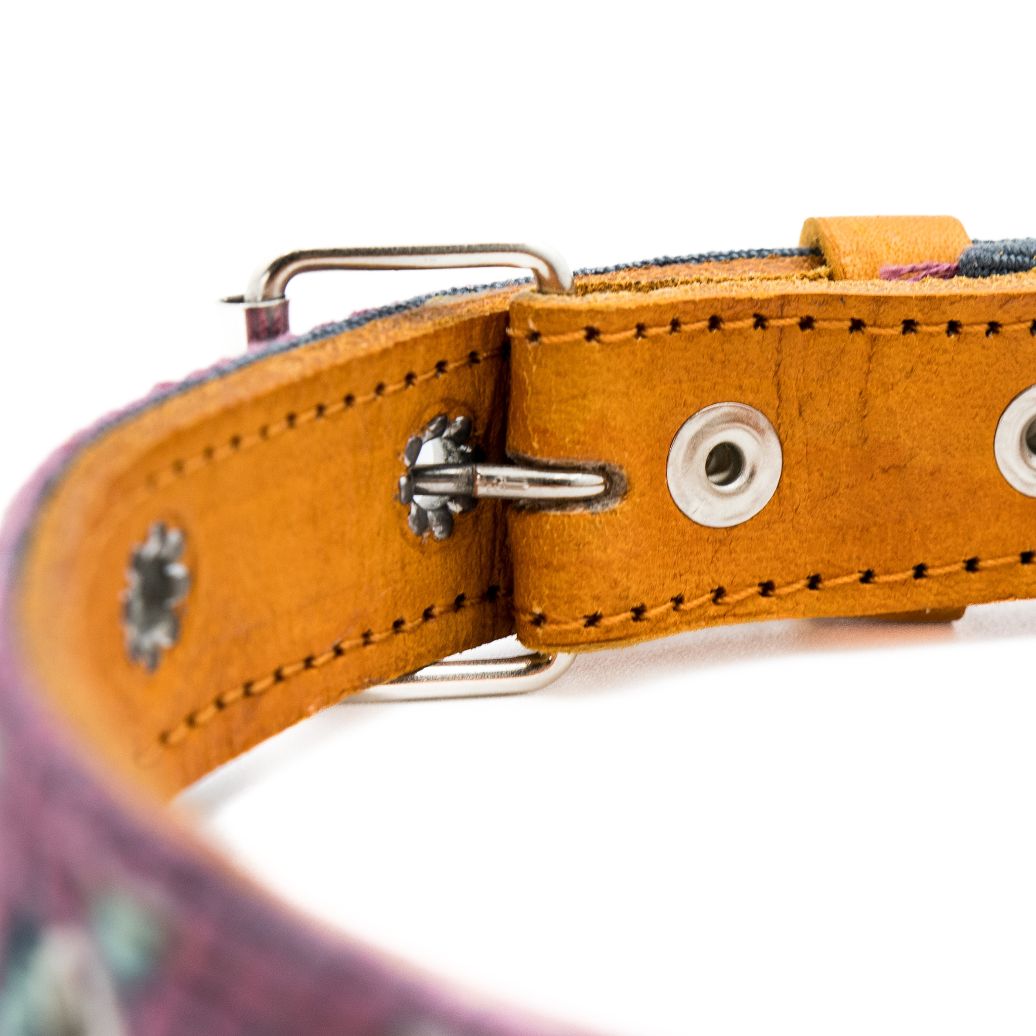 Backside of a leather buckle on a Camelot dog collar, showcasing the quality leather craftsmanship.