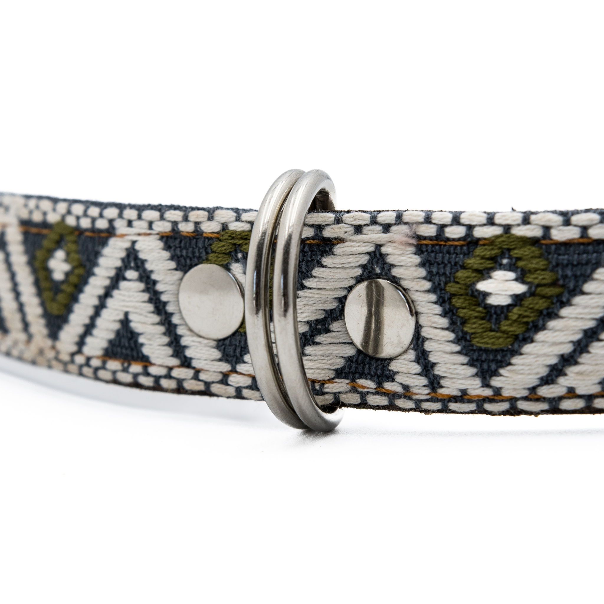 Detailed view of the D-ring and intricate embroidery on a Ceramic Cello leather dog collar.